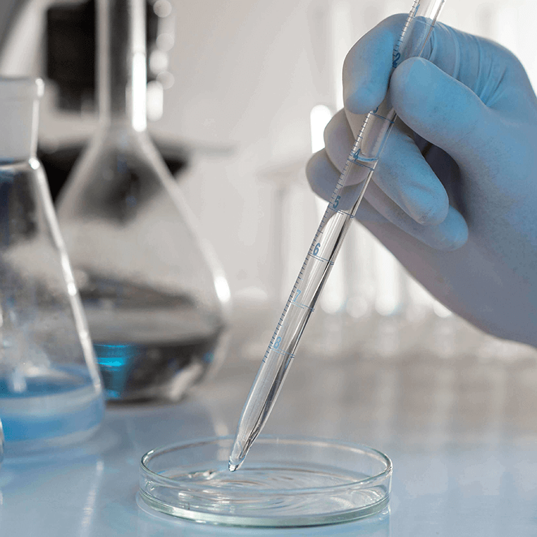 stopl-close-up-hand-holding-lab-pipette stopl-close-up-hand-holding-lab-pipette